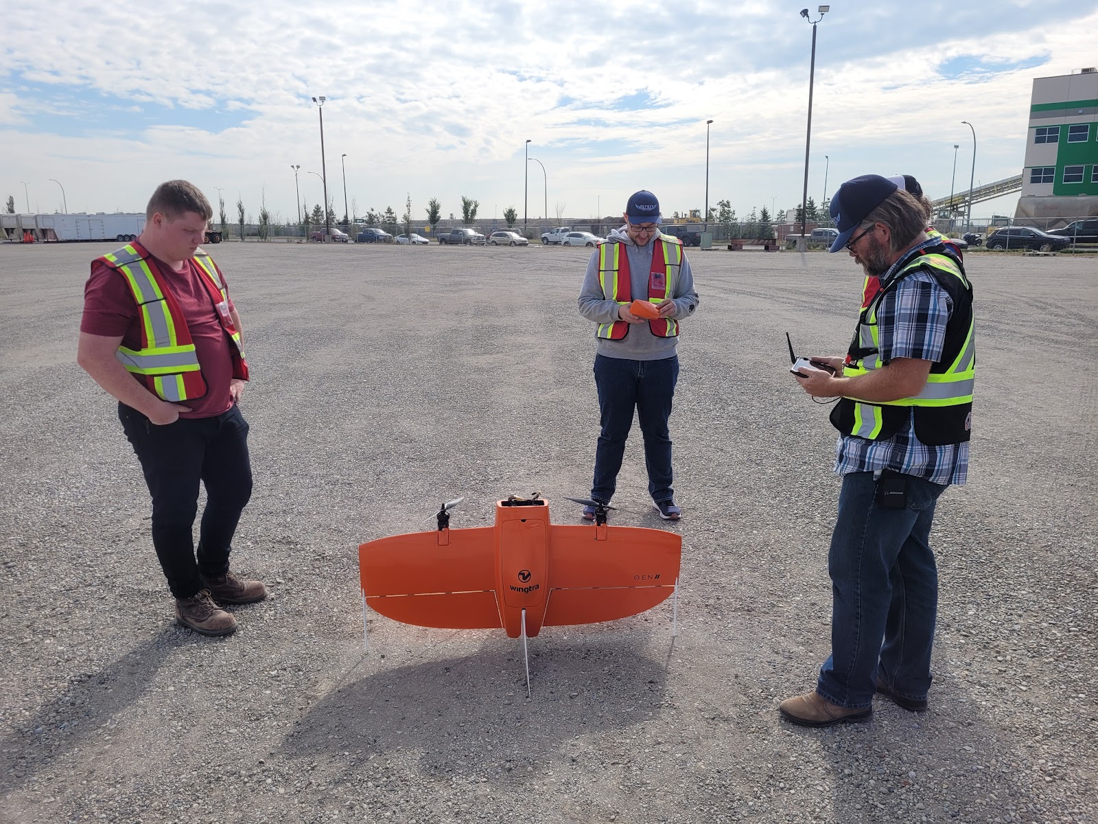Field team setting up a VTOL drone